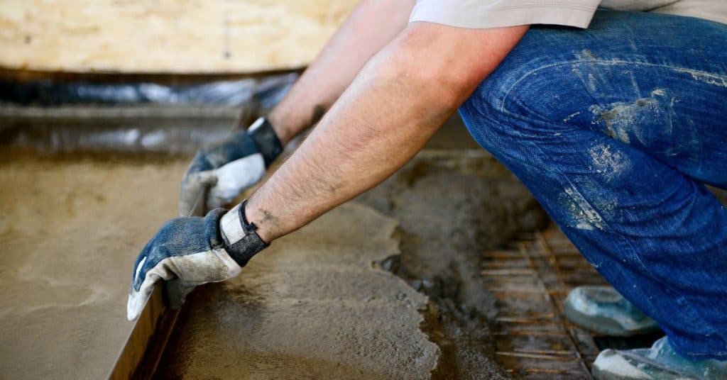 Can concrete be poured over plastic?