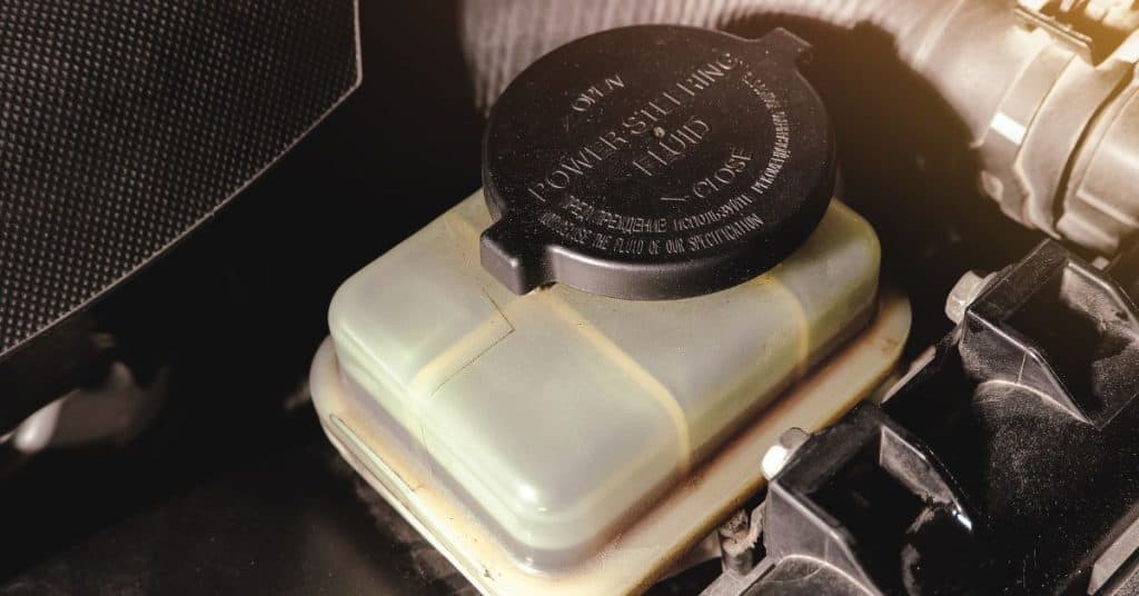 How to put power steering fluid in car