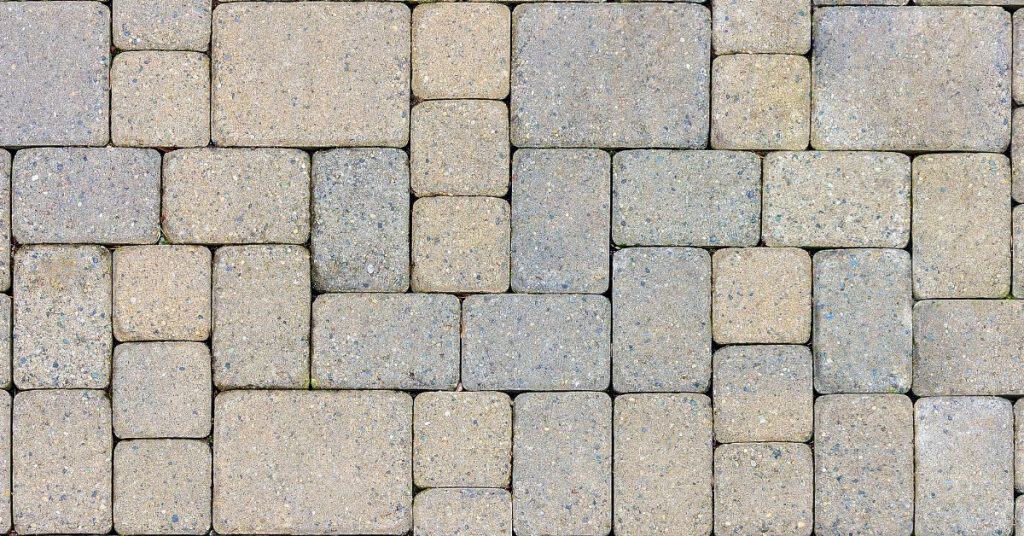 Is stamped concrete cheaper than pavers