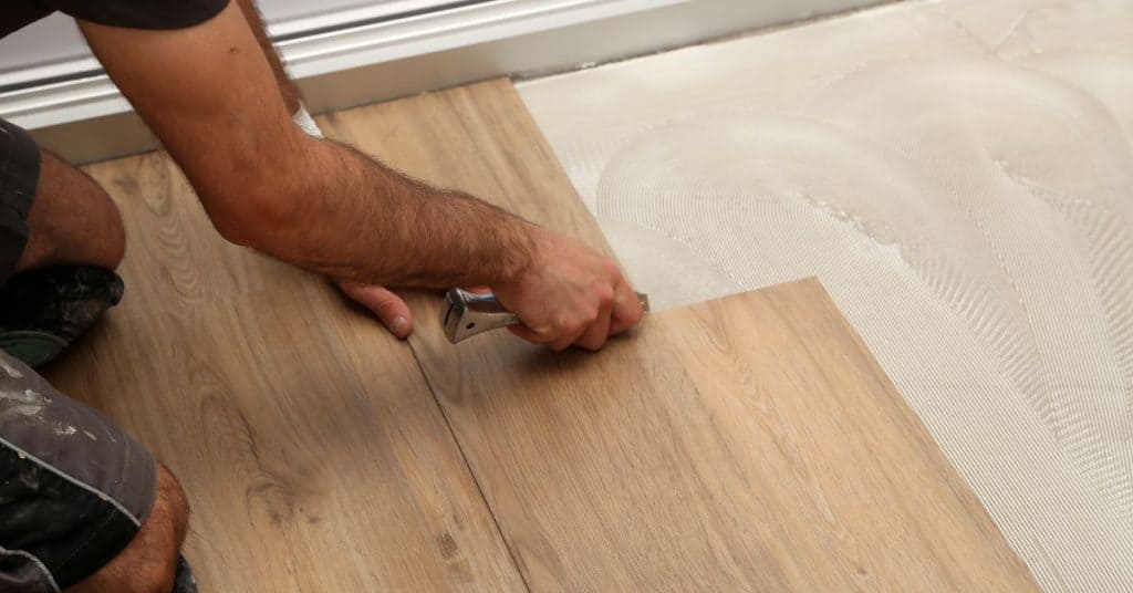 What happens if water gets under vinyl flooring