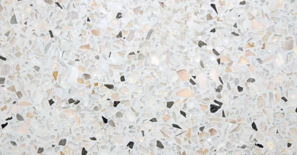 Close-up of terrazzo surface with mixed decorative chips in cement