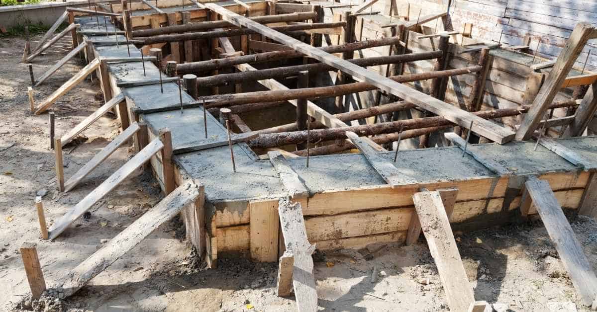 Braced wooden formwork for concrete foundation with exposed rebar