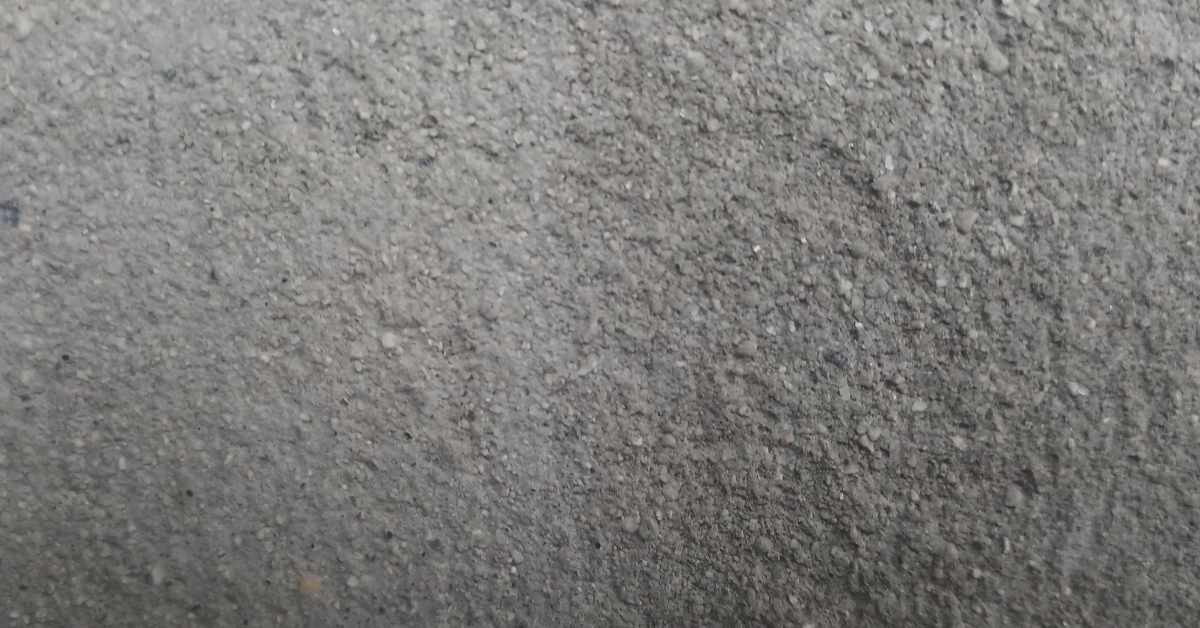 Close-up of loose gray concrete mix with small aggregate particles – alternate view 2