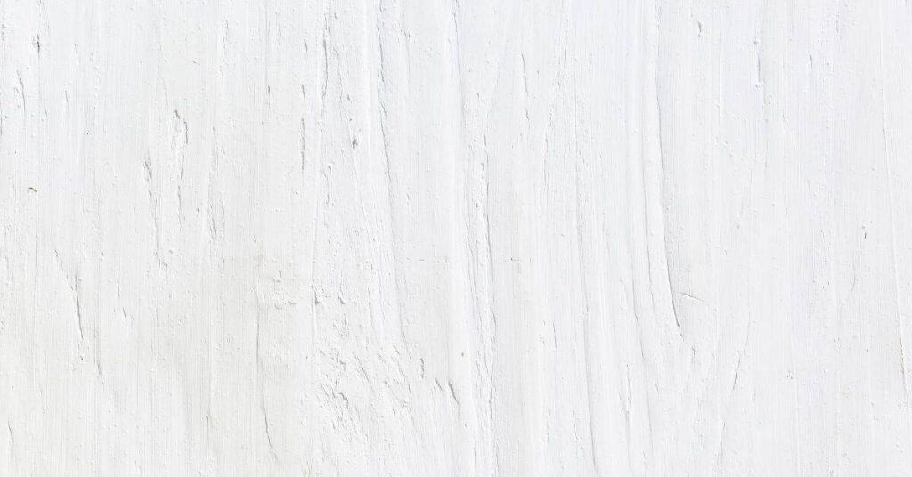 Close-up of rough white plaster wall texture