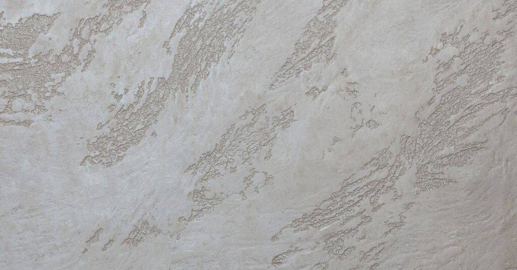 close-up of textured plaster wall with subtle sheen