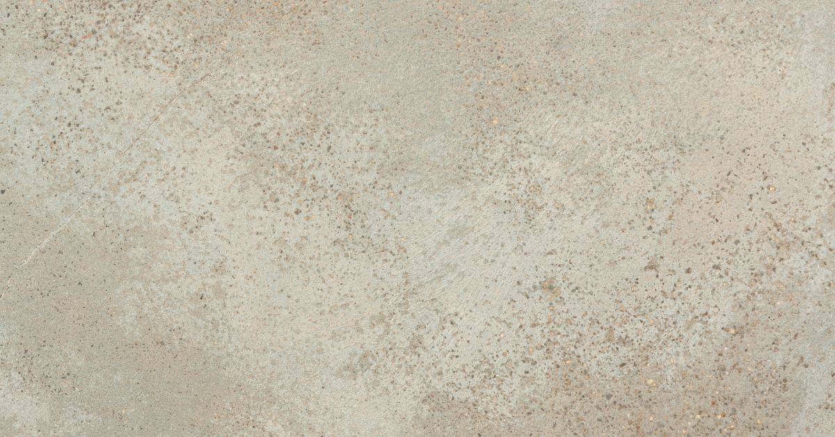closeup of concrete surface with uneven texture and discoloration
