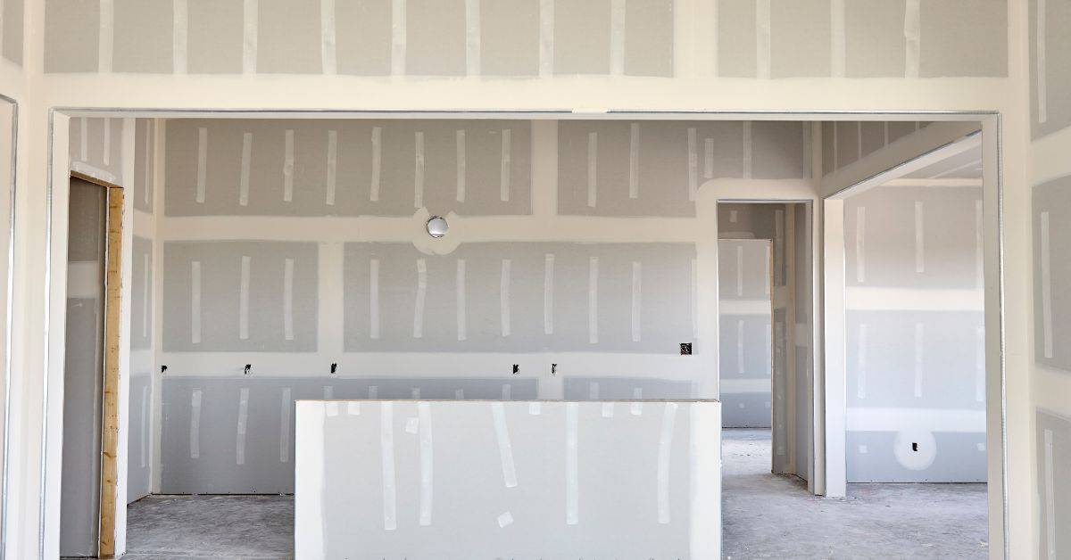 Unfinished interior walls with drywall installed and taped seams