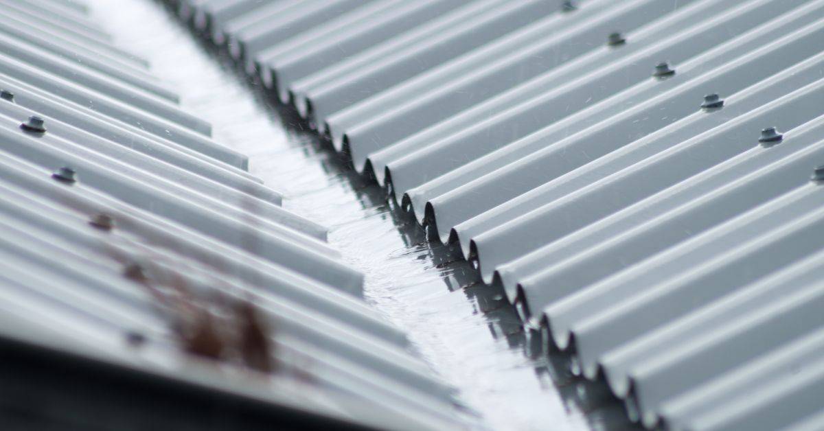 Close-up of corrugated metal roof sections joined together