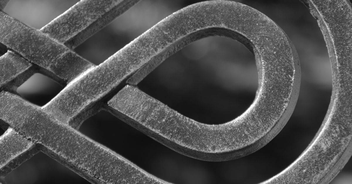 close-up of wrought iron metal fence detail