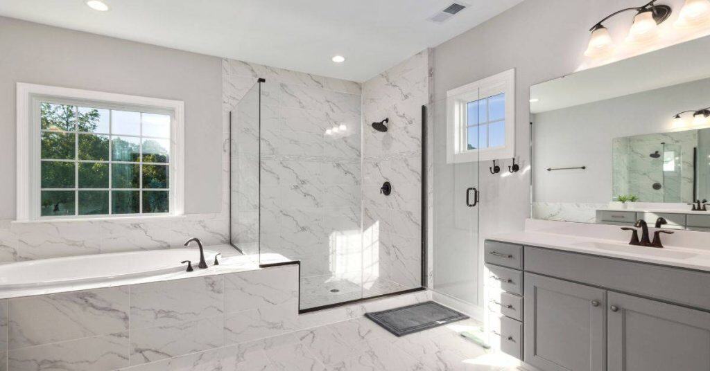 Modern bathroom with glass shower and marble tiles