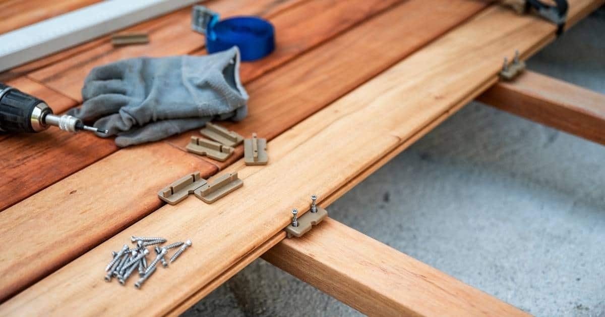 Wooden deck boards with screws and installation clips