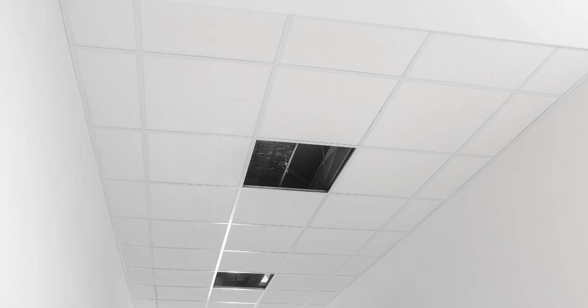 White drop ceiling with missing ceiling tiles