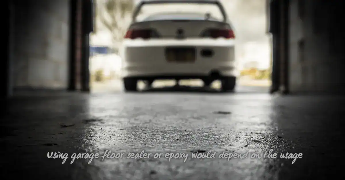 Close-up of a textured concrete garage floor with a car in background