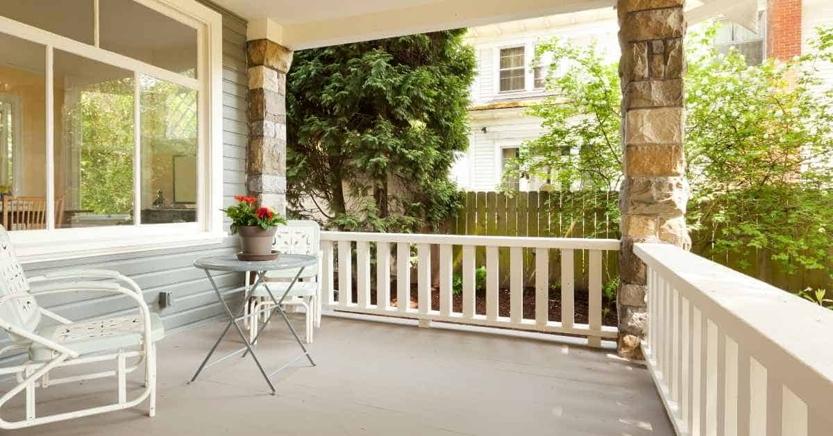 Painted concrete porch floor with outdoor chairs and table