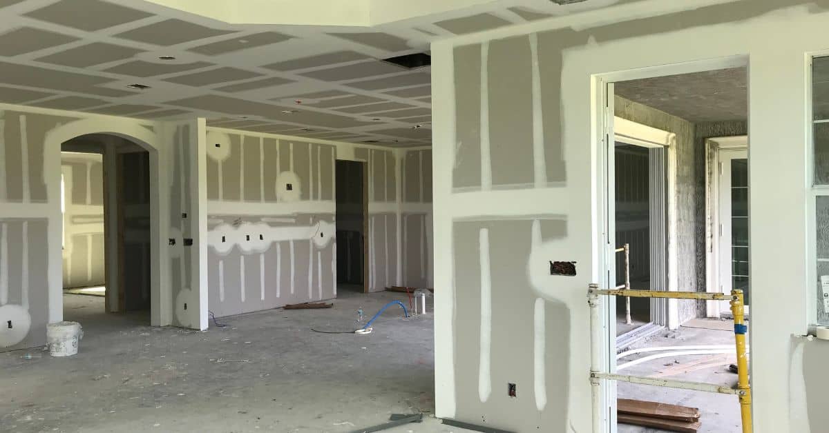 Unfinished interior walls with drywall taped and mudded