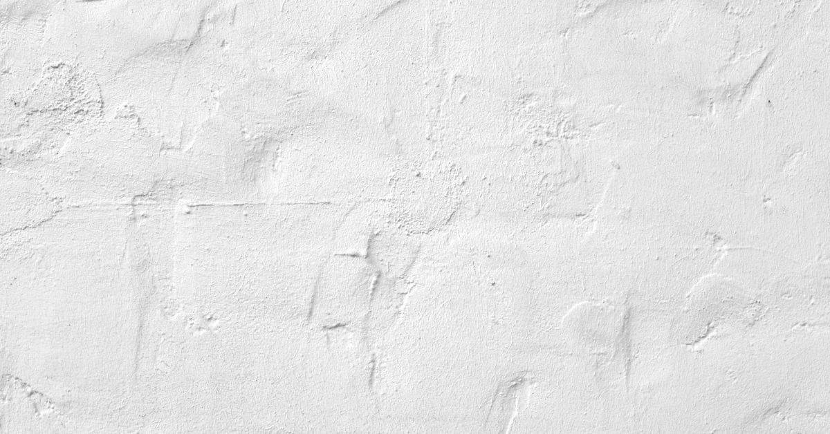 close-up of white textured old plaster wall surface