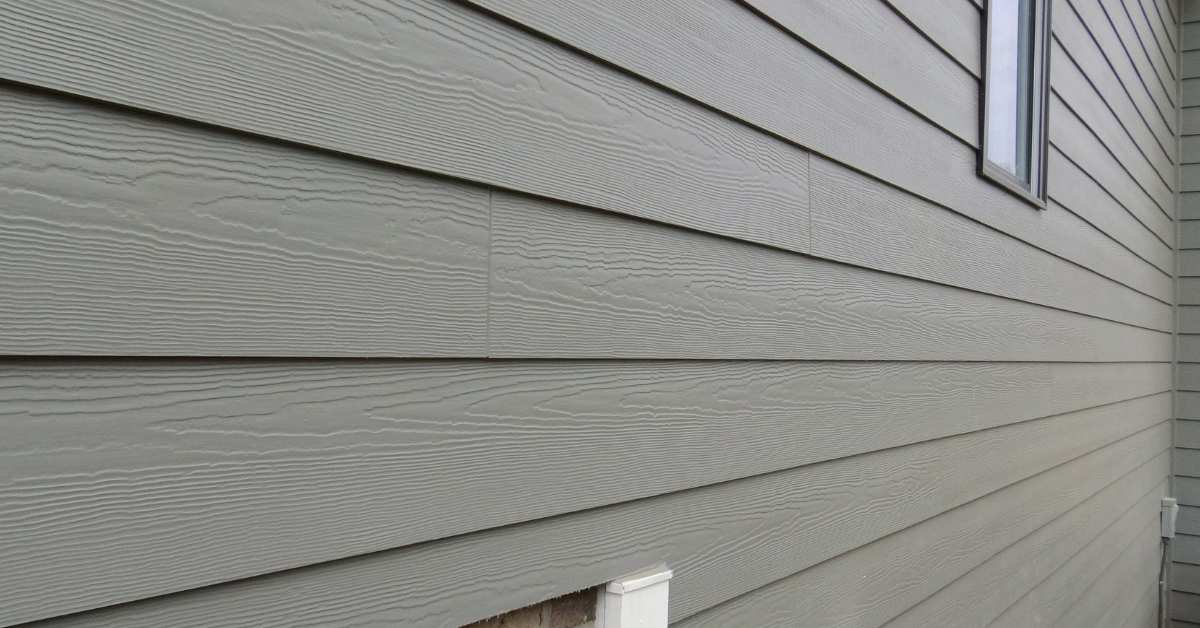 Gray fiber cement siding panels on exterior wall
