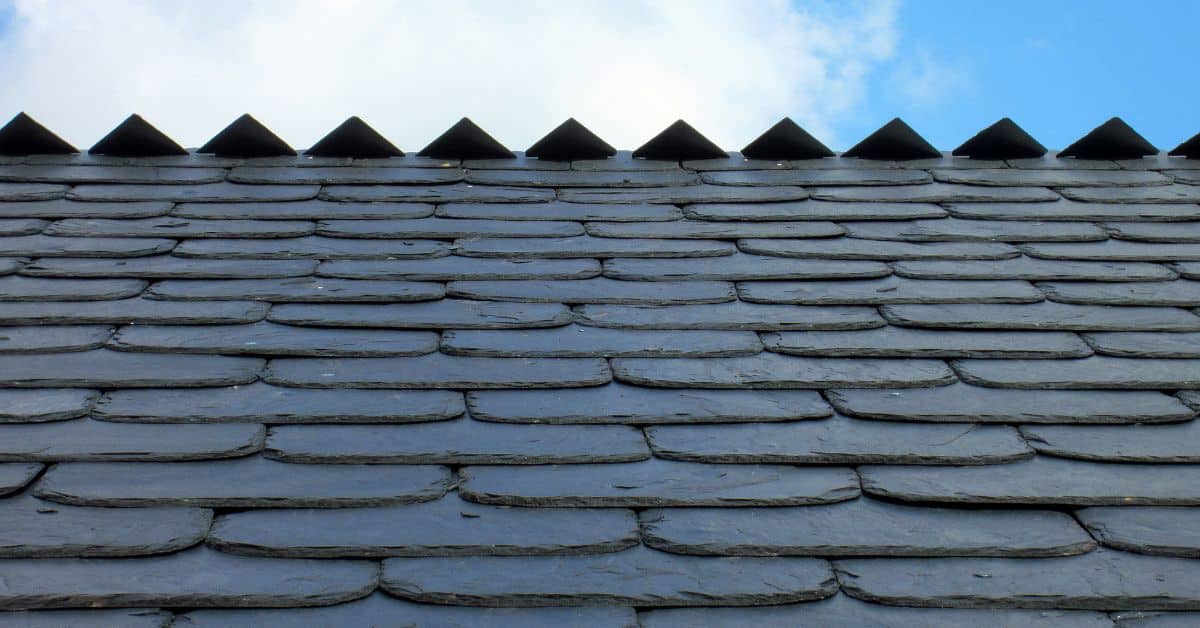 Close-up of slate roof tiles arranged in overlapping pattern