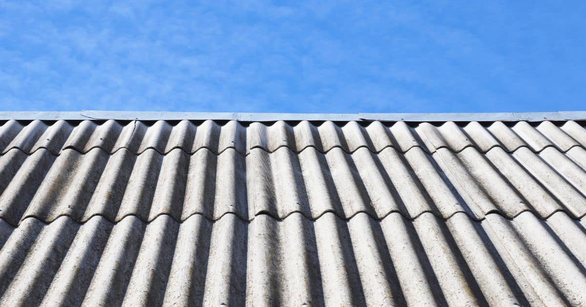 Close-up of corrugated concrete roof panels against blue sky