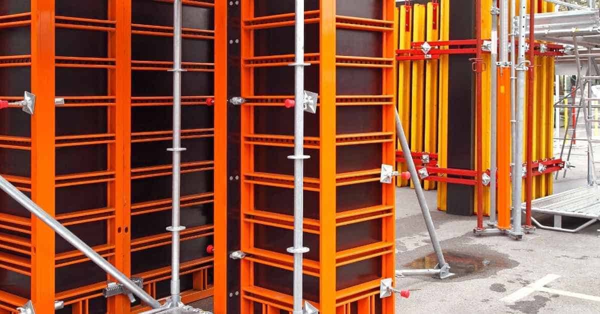 Orange and yellow steel shuttering forms on construction site