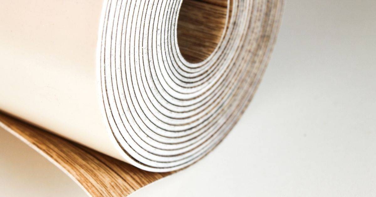Close-up of rolled vinyl flooring material with wood pattern
