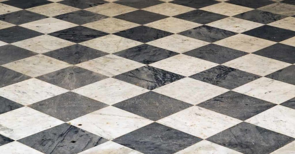 Black and white checkered tile floor with marble texture