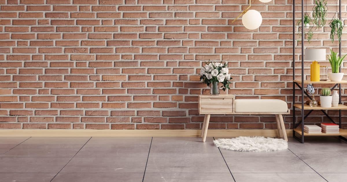 Interior room with exposed brick wall wooden bench and shelving unit