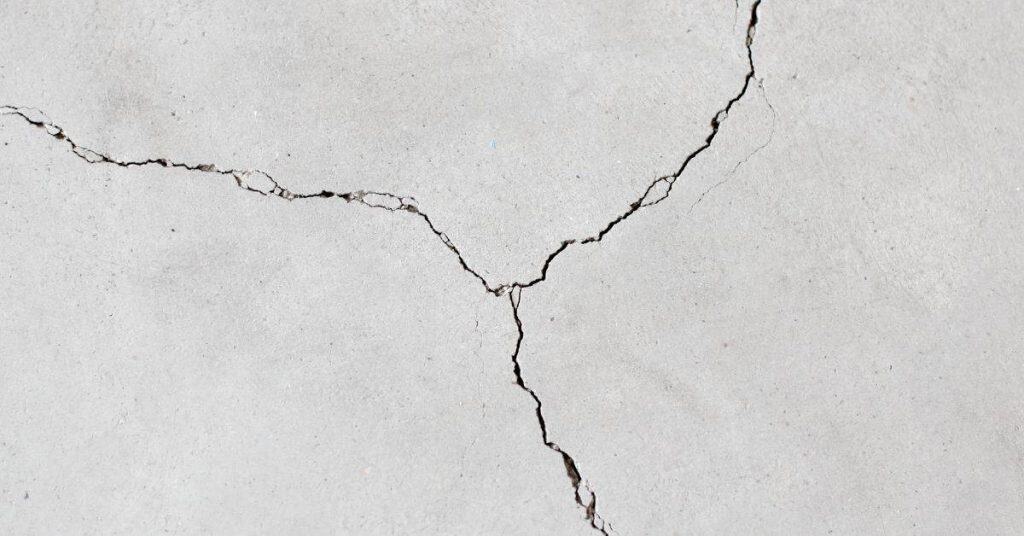 Close-up of a concrete surface with multiple cracks