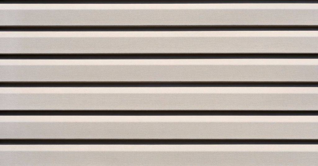 Close-up of beige horizontal lap fiber-cement siding