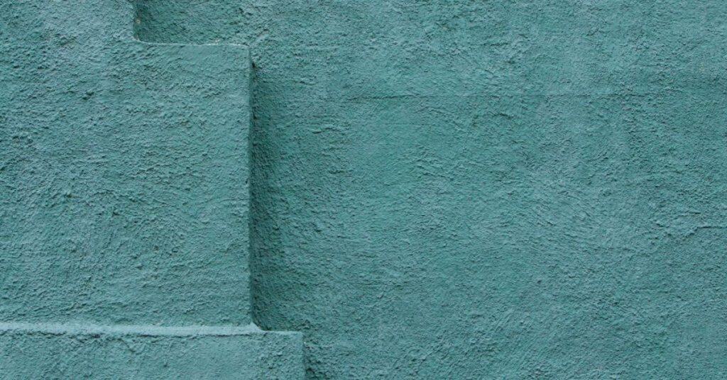 close-up of blue textured stucco wall surface