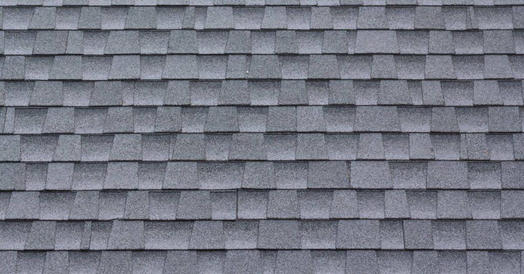 Close-up of gray asphalt shingle roof tiles