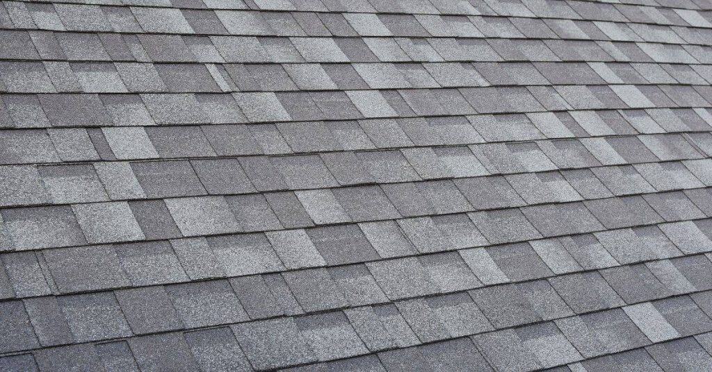 Close-up of gray asphalt shingle roofing pattern