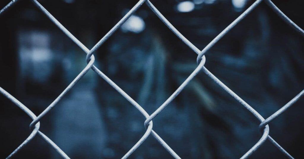 Close-up of metal chain-link fence outdoors