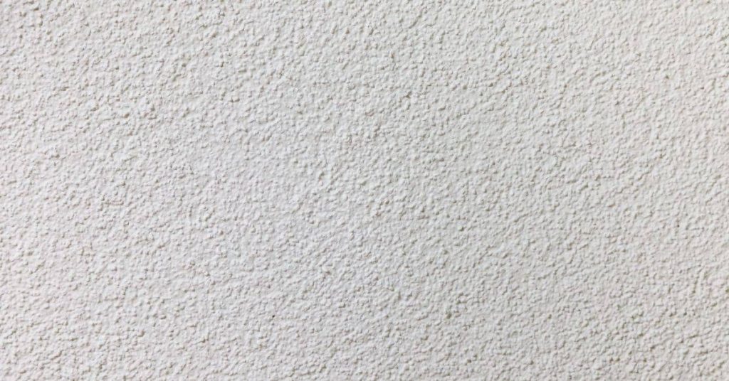 Close-up of painted textured drywall surface