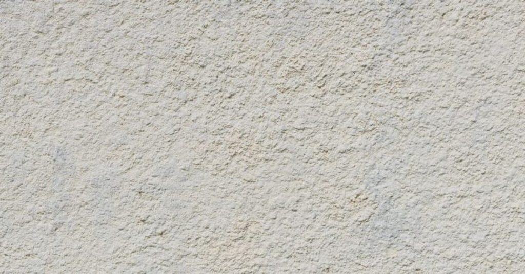 Close-up of rough textured stucco wall surface