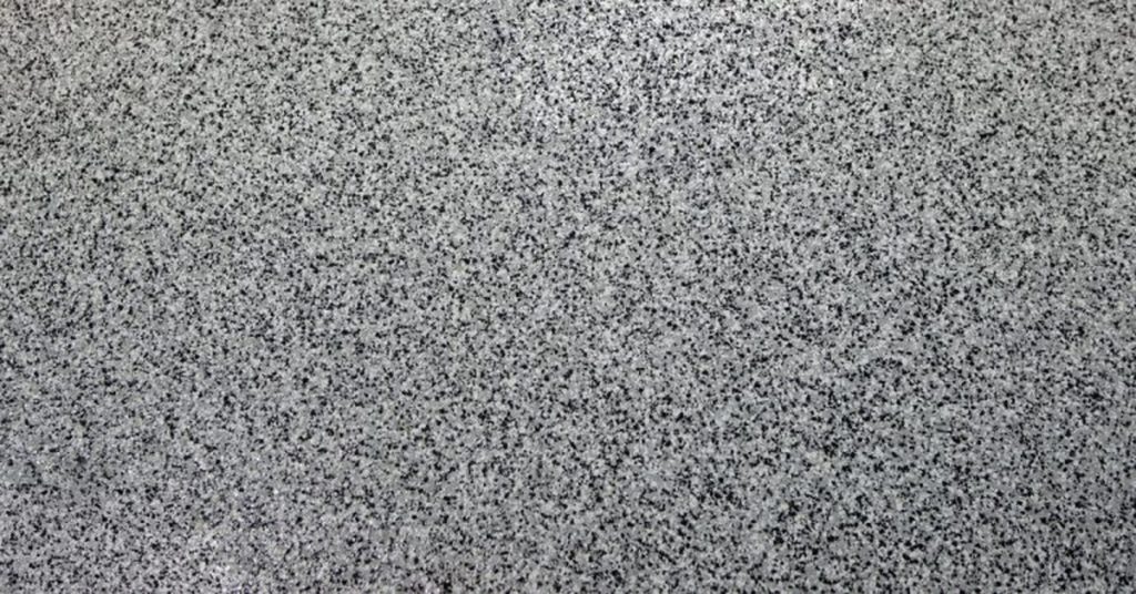 Close-up of speckled gray epoxy coated floor surface