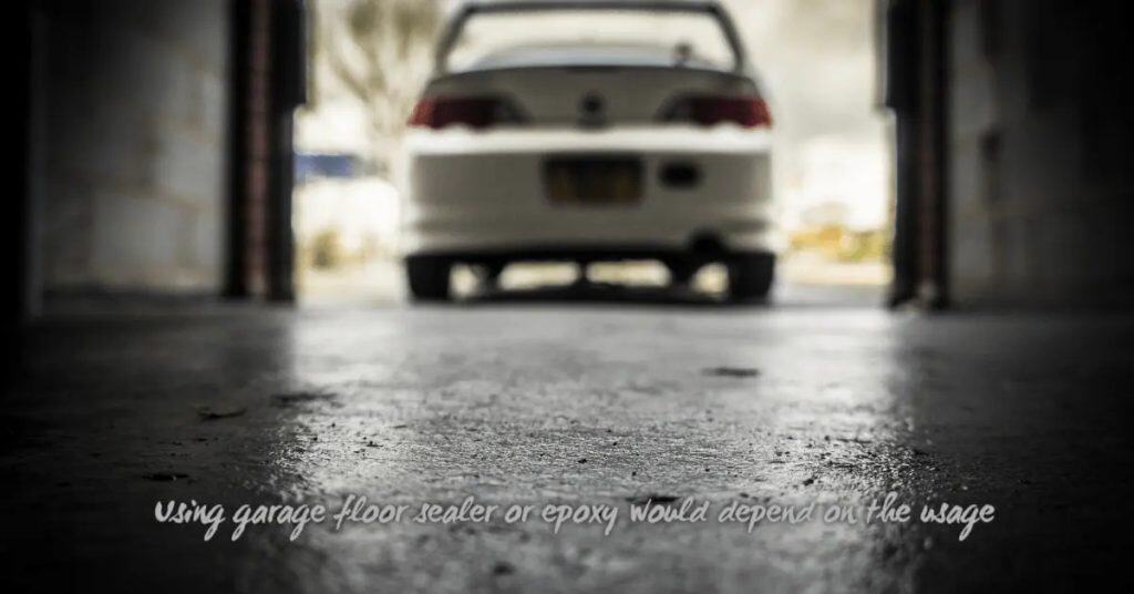 Close-up of textured concrete garage floor with white car in background