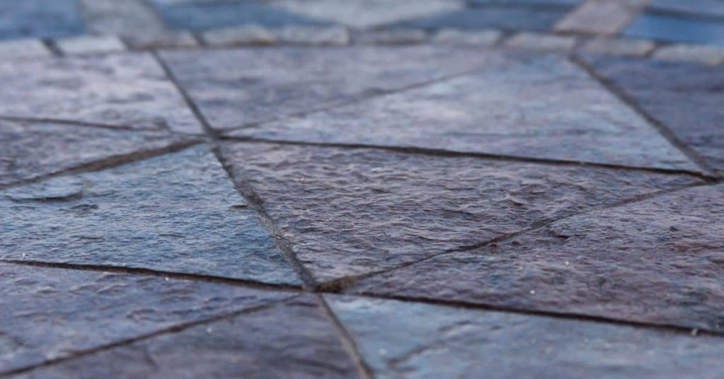 Close-up of textured stamped concrete floor surface