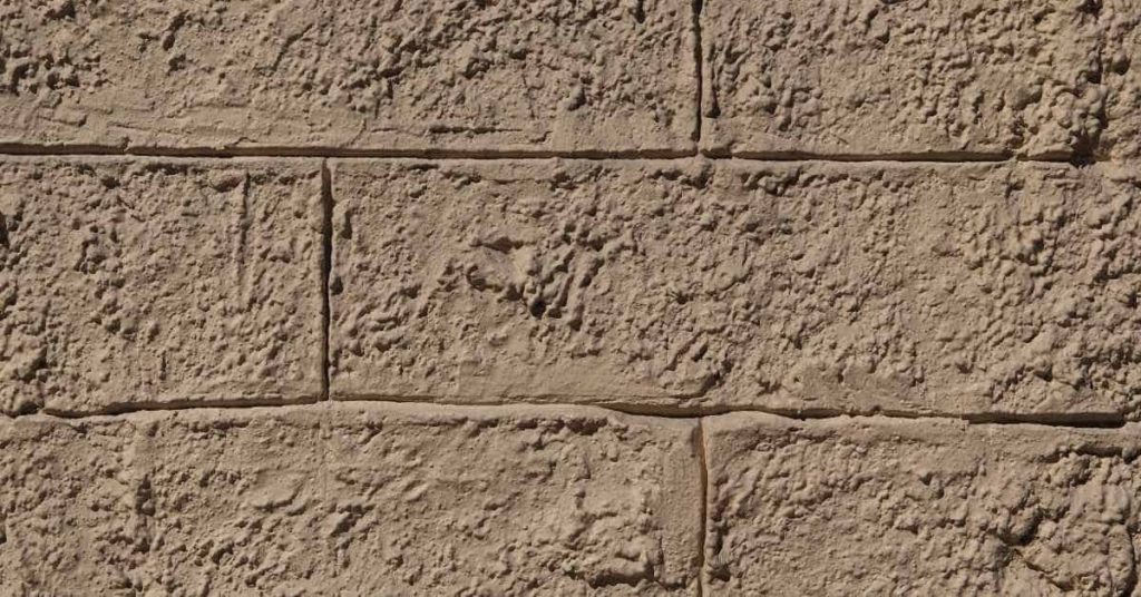Close-up of textured stucco block wall