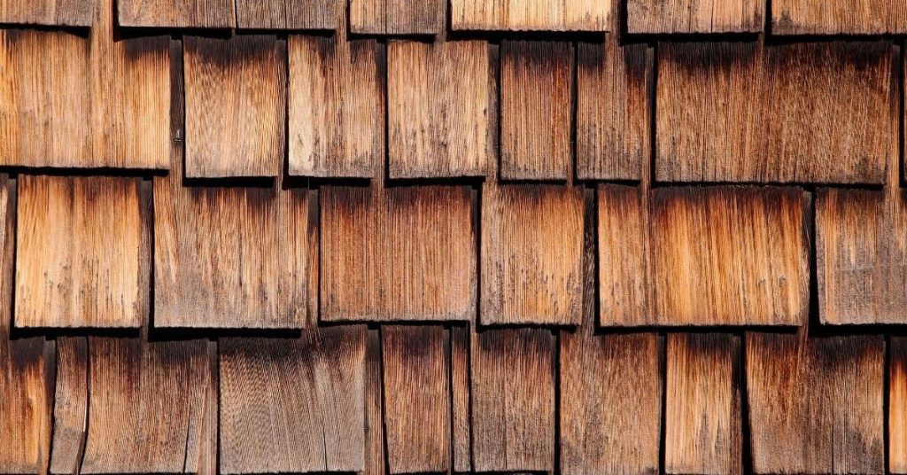 Close-up of weathered wood shingle roof in sunlight