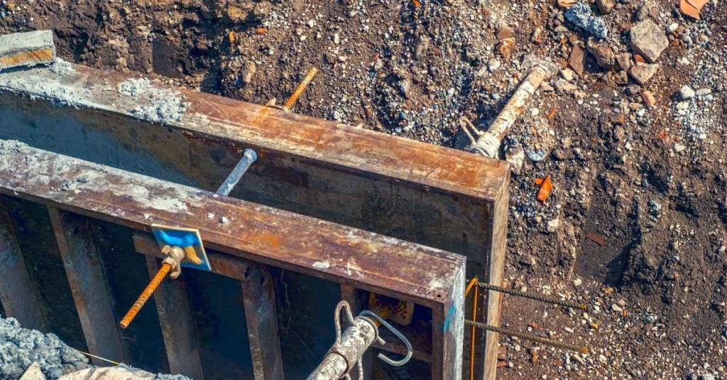 metal concrete formwork with rebar and anchors in soil