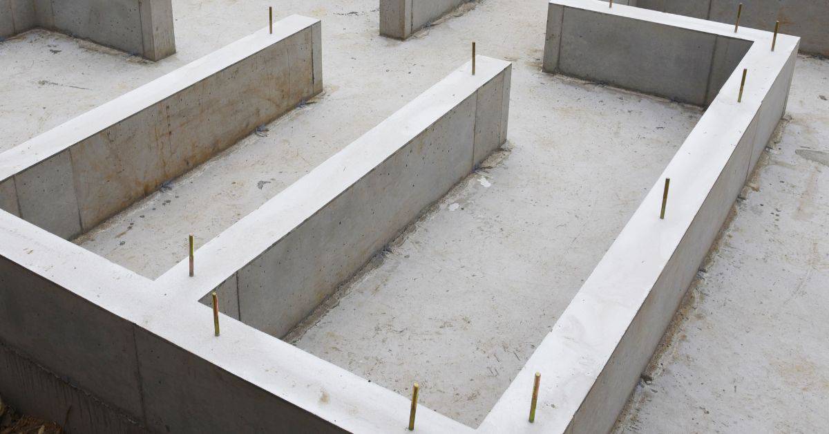 Concrete foundation forms with metal rods inserted