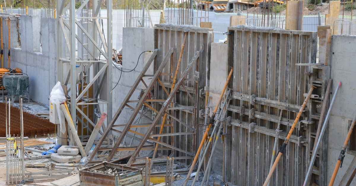 Concrete wall formwork with metal braces on construction site