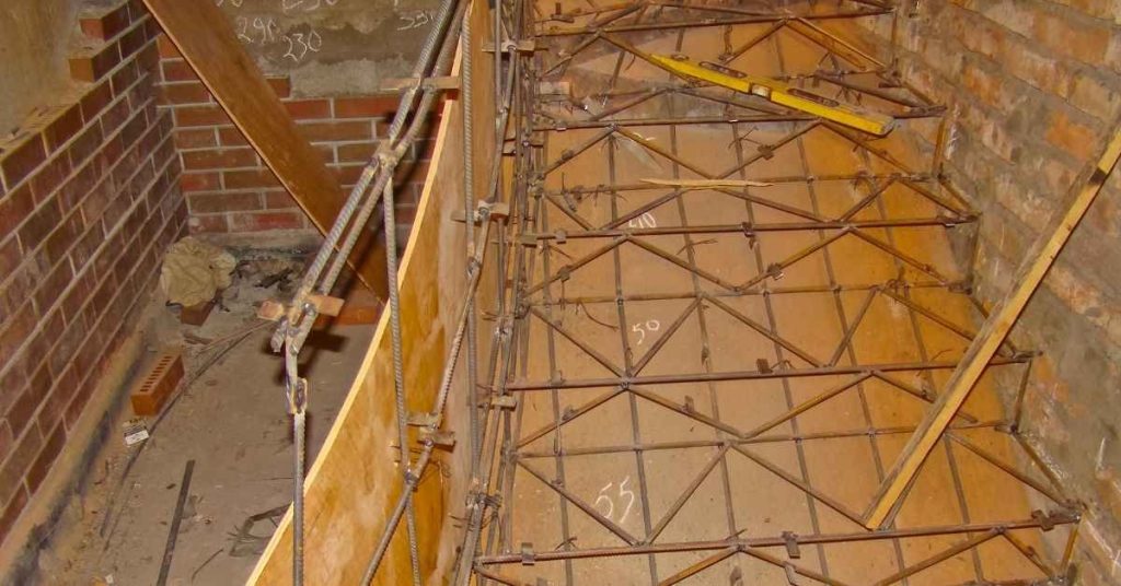 Concrete formwork with rebar inside brick walls