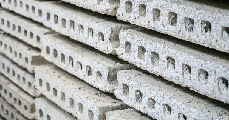 Close-up of stacked hollow core concrete slabs outdoors