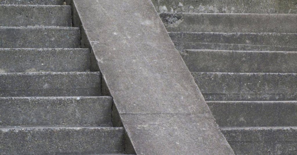 Concrete stairs with a smooth concrete ramp in the middle