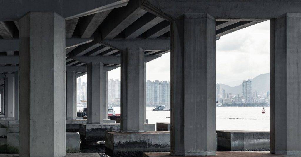 Concrete support columns under a waterfront bridge