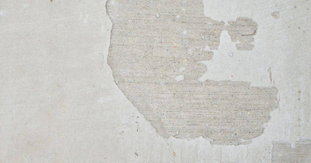 Concrete surface with visible edge spalling damage