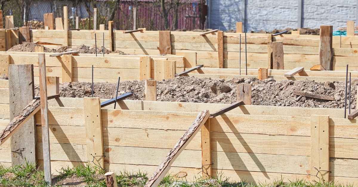 Wooden formwork structures filled with soil for concrete foundation