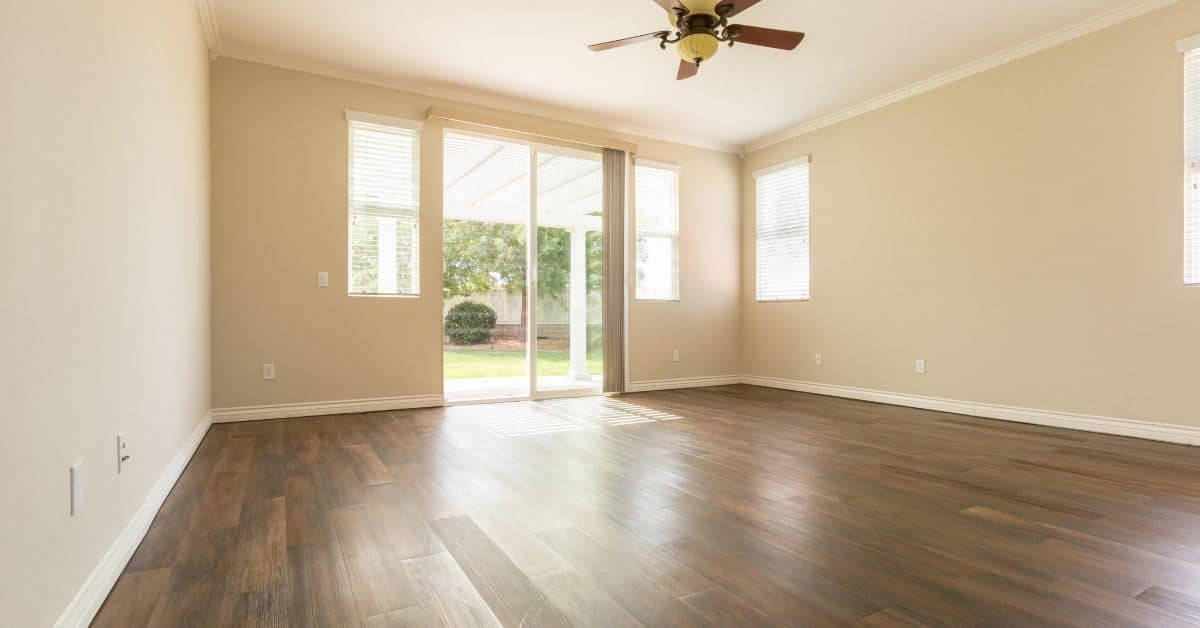 Empty room with brown wood-look vinyl plank flooring
